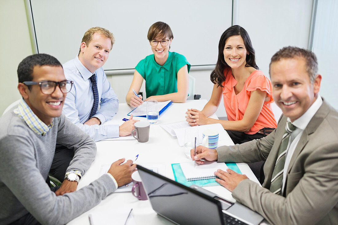 Business people smiling in meeting