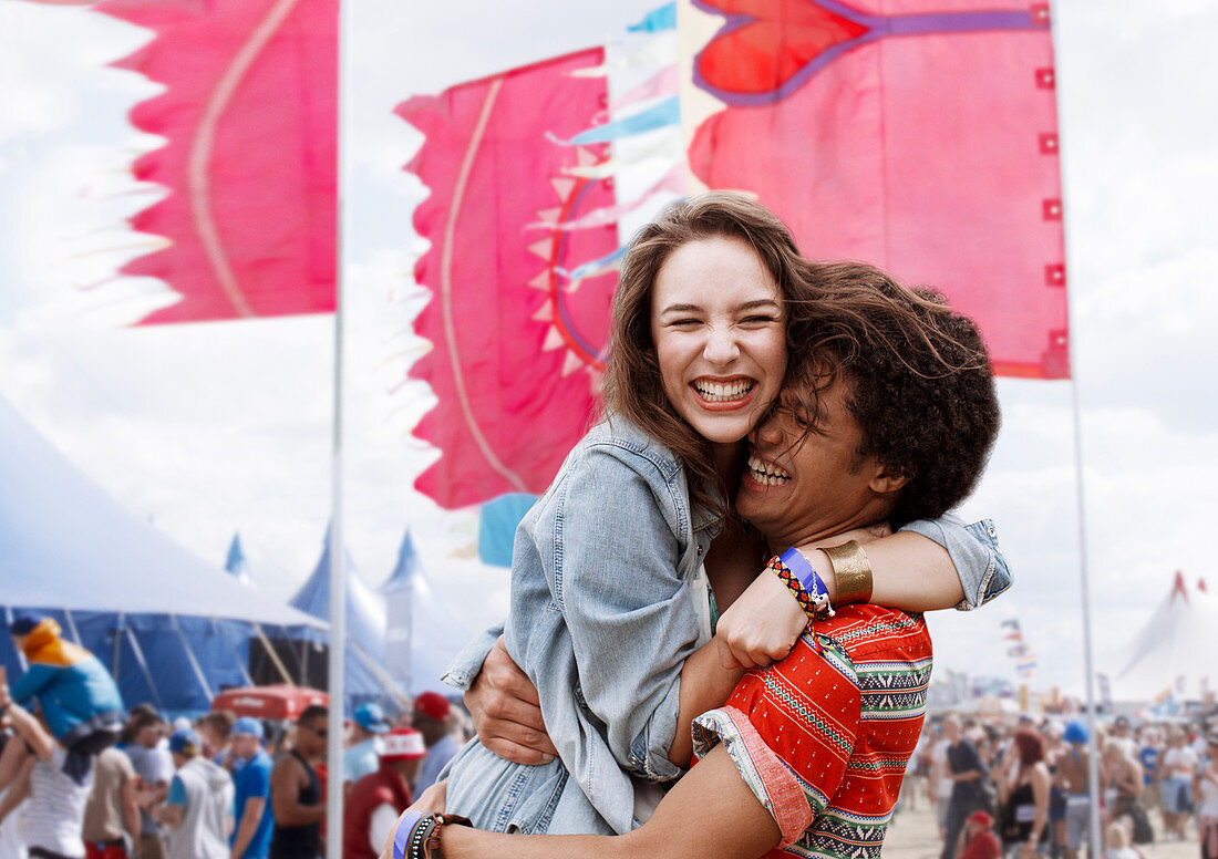 Enthusiastic couple hugging