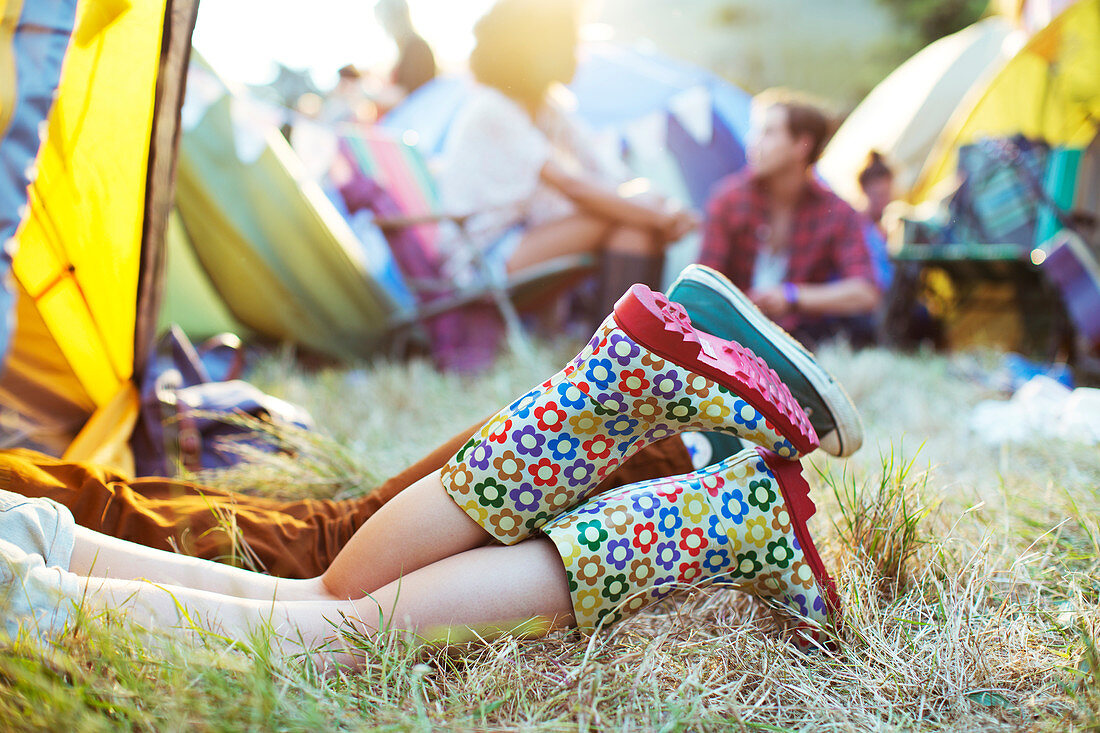 Couple's legs sticking out of tent