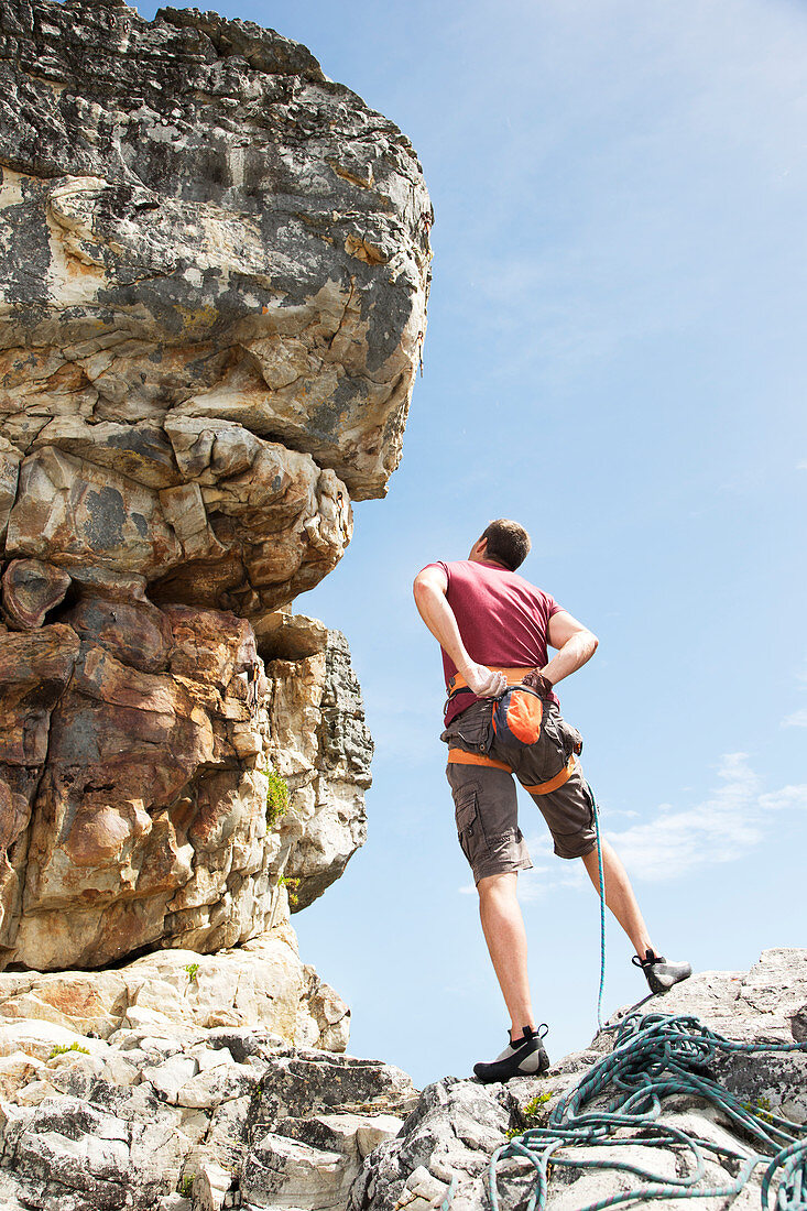 Climber examining rock formation