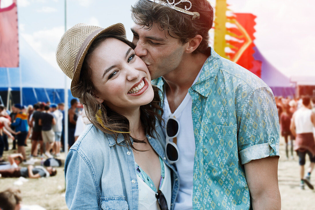 Couple kissing at music festival