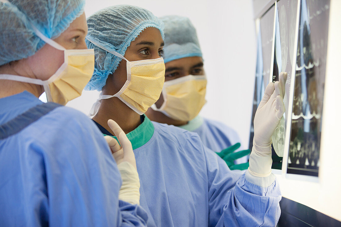 Surgeons examining x-rays