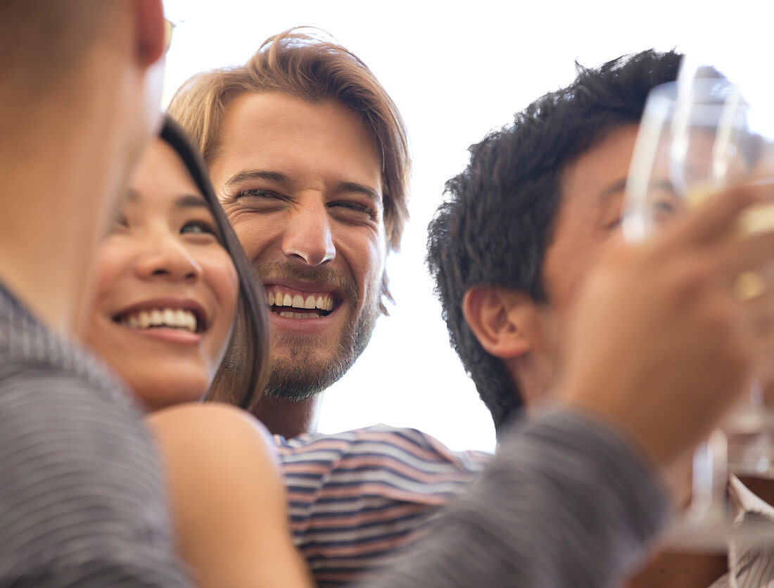 Friends laughing at party