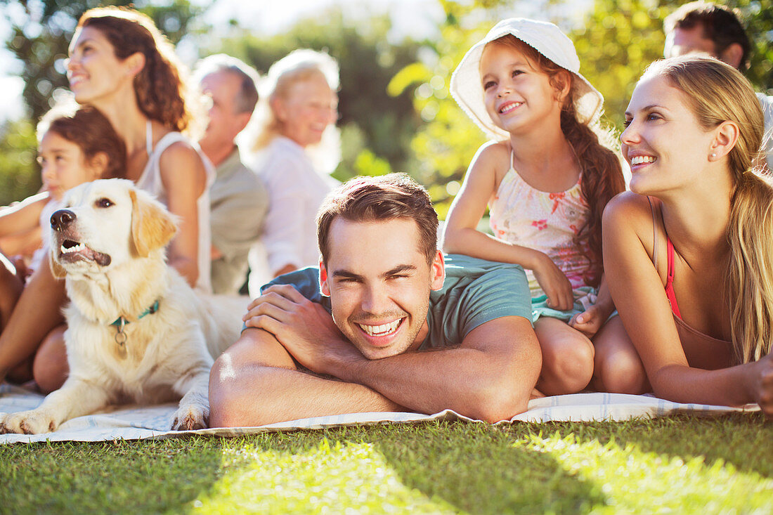 Family relaxing in backyard