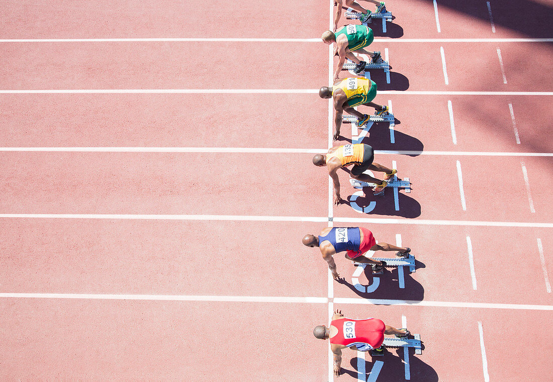 Runners waiting at starting block