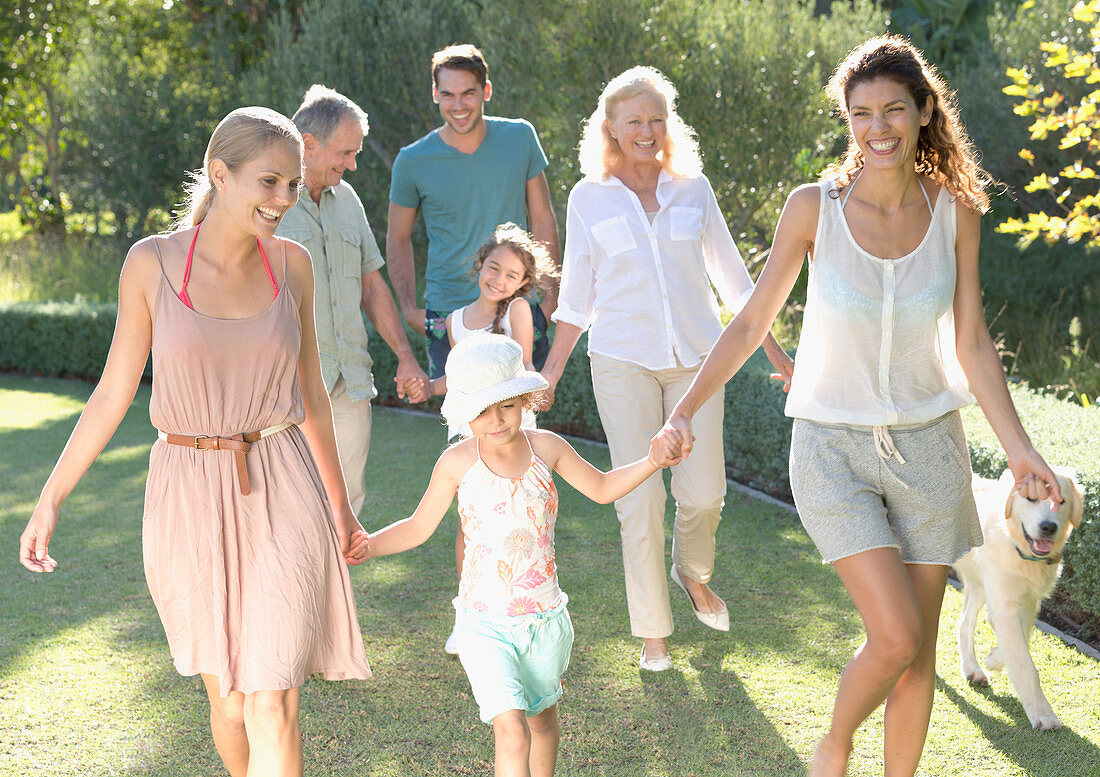 Family walking together in backyard