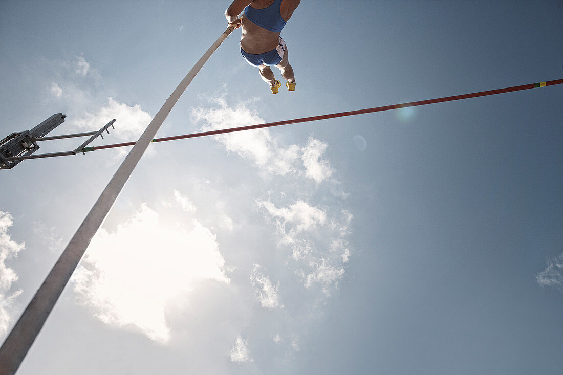 Pole vaulter clearing bar