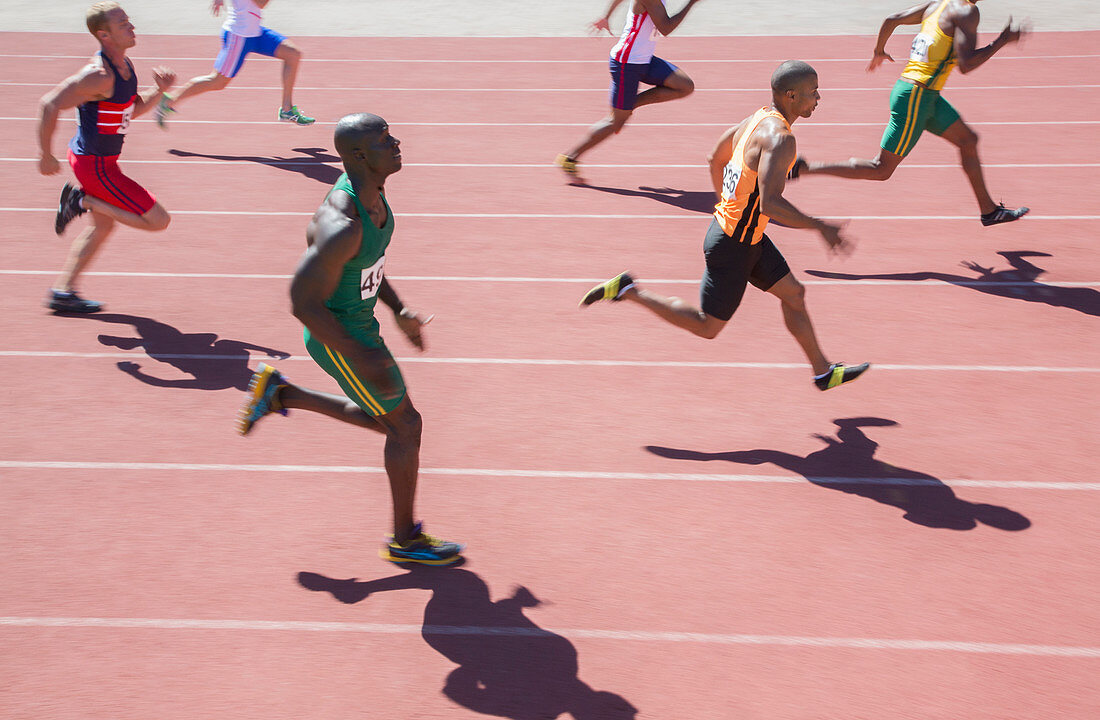 Runners racing on track