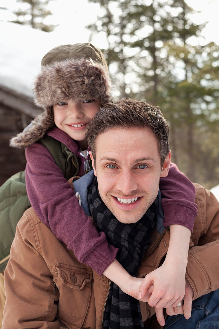 Father piggybacking son