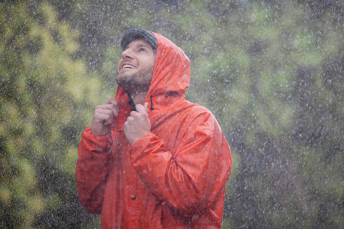 Smiling man with raincoat