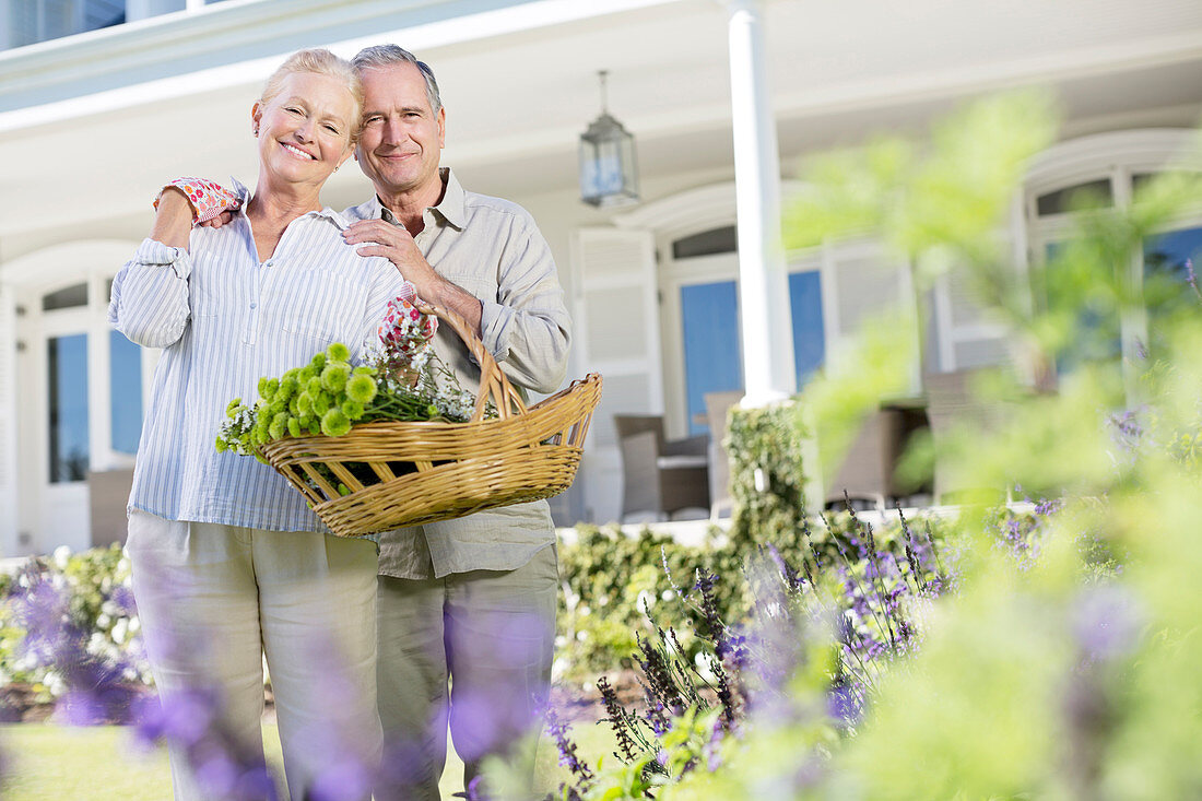 Senior couple hugging in garden