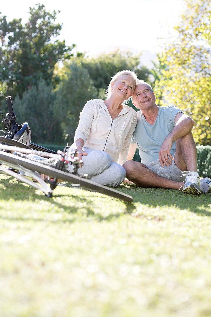 Senior couple sitting with bicycles