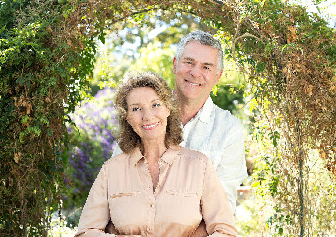 Smiling senior couple in garden