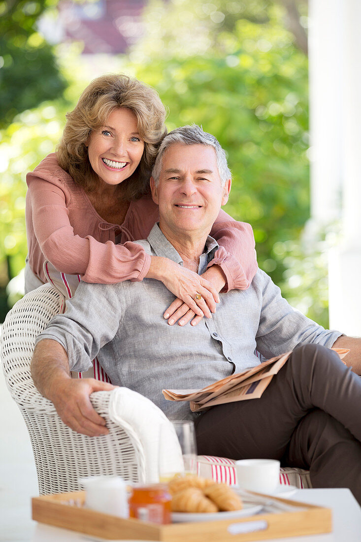 Portrait of smiling senior couple hugging