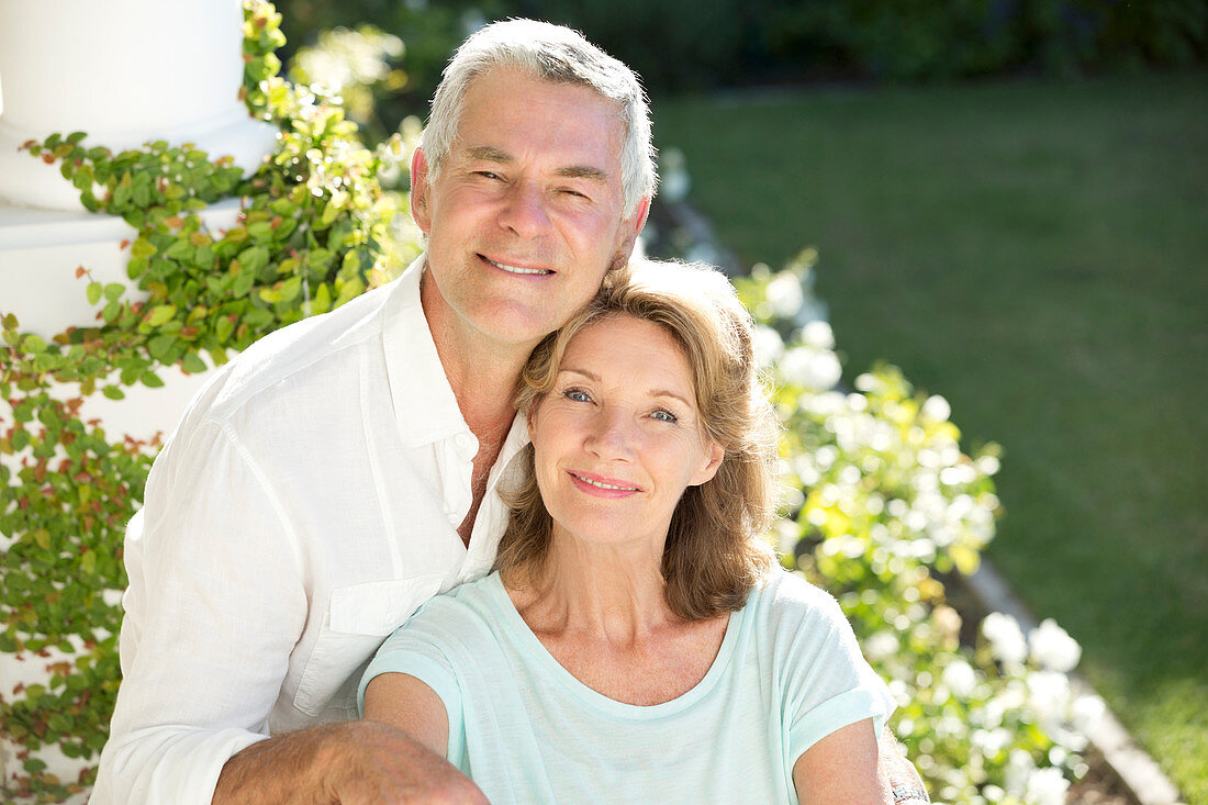 Smiling senior couple in garden