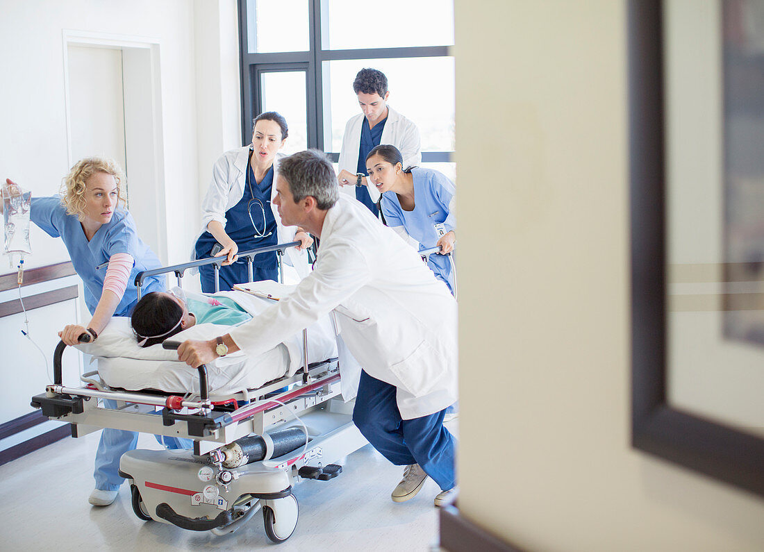 Doctors and nurses rushing patient