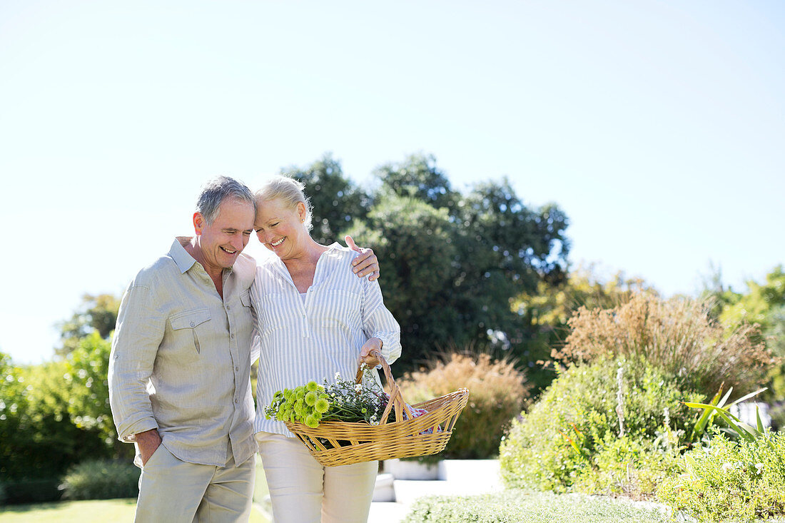 Senior couple walking with basket