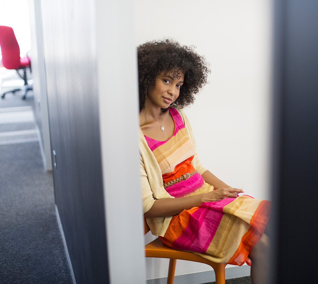 Smiling woman sitting in chair