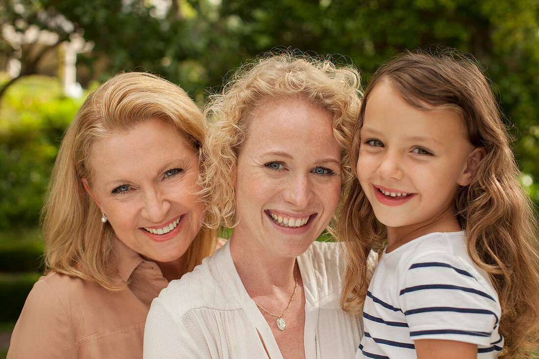 Three generations of women smiling