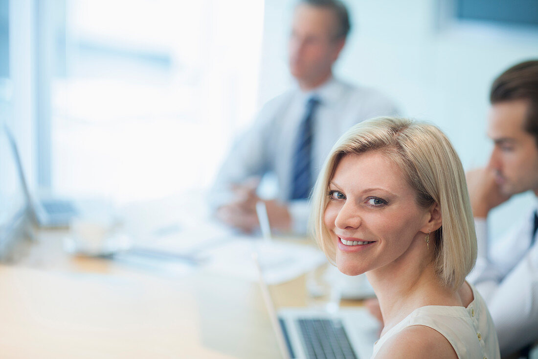 Businesswoman smiling in meeting