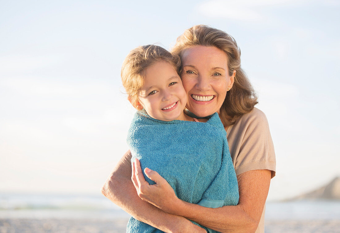 Grandmother and granddaughter hugging