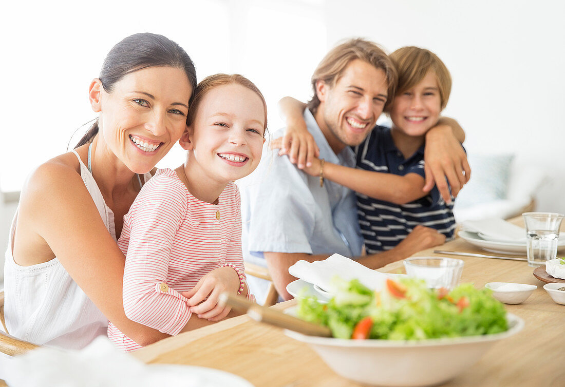 Family sitting together at table