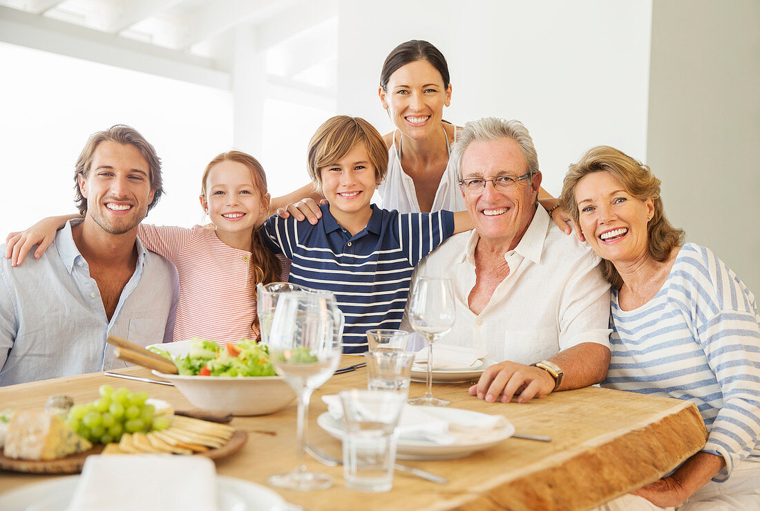 Family smiling together at table