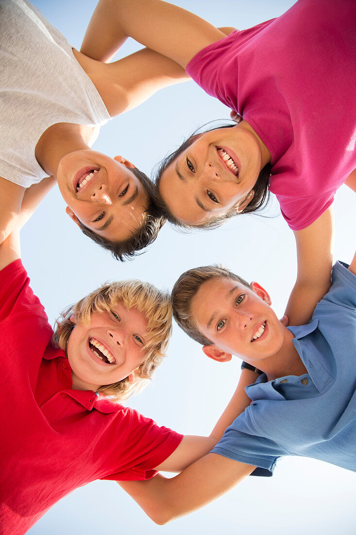 Children smiling in huddle