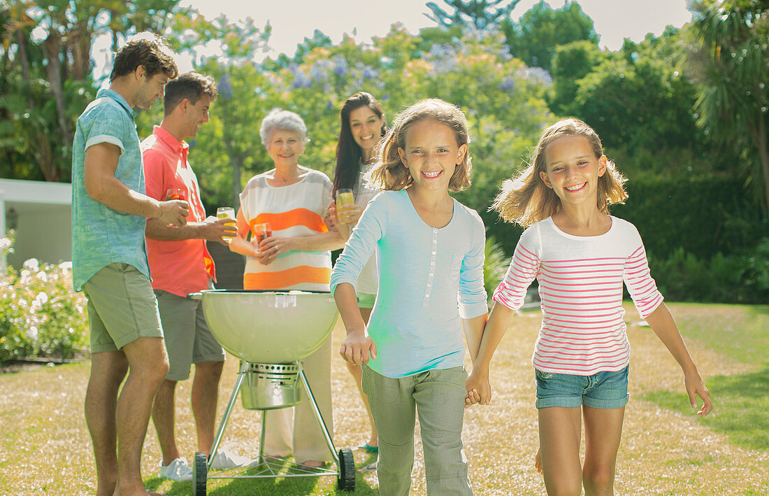 Family relaxing together in backyard