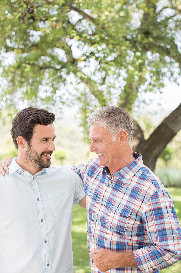 Father and son hugging outdoors