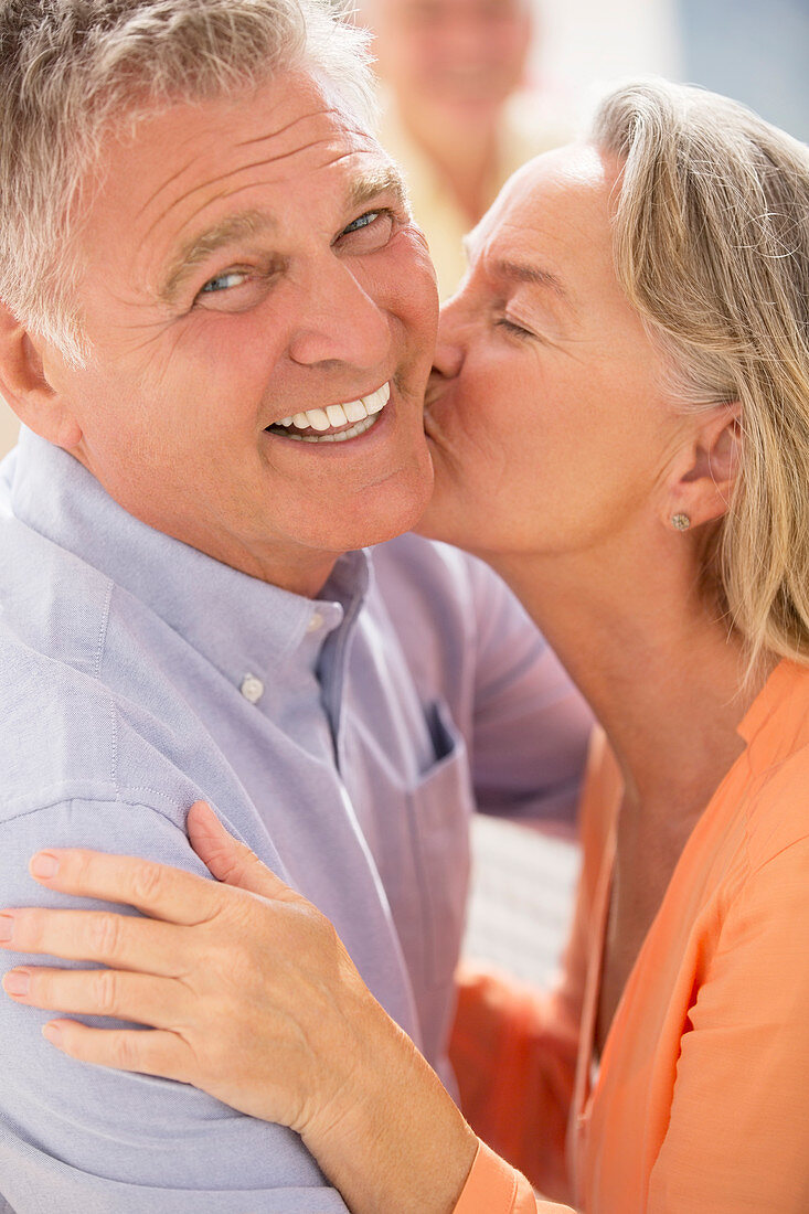 Senior couple kissing