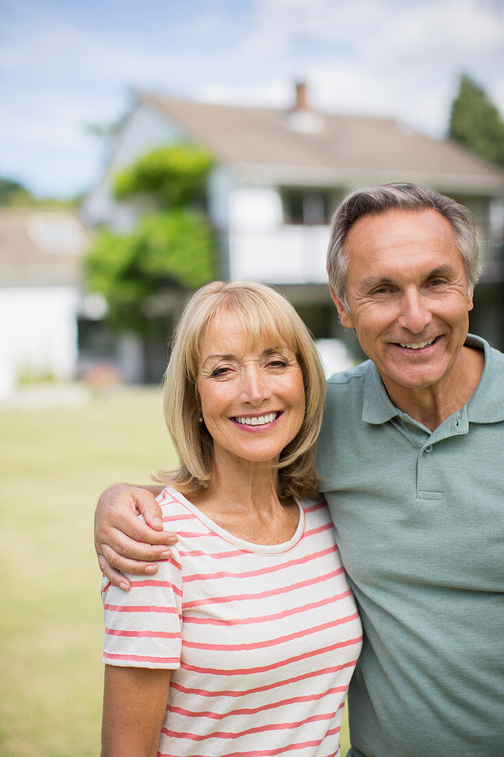 Senior couple hugging outdoors