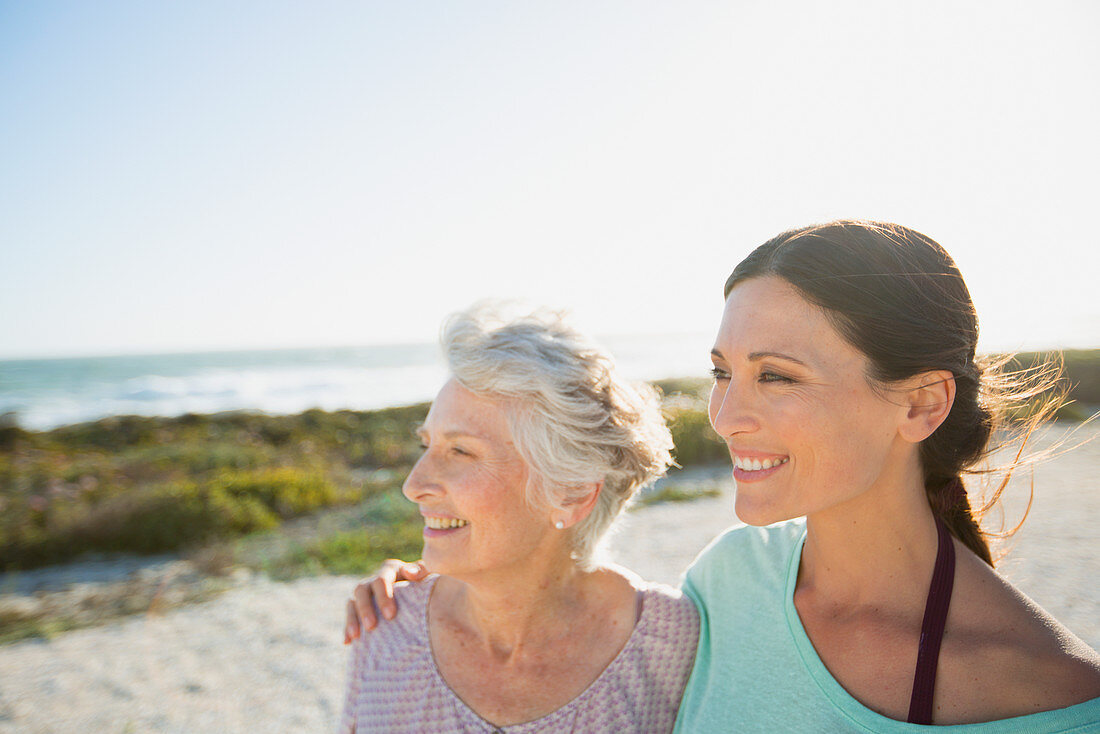 Mother and daughter smiling