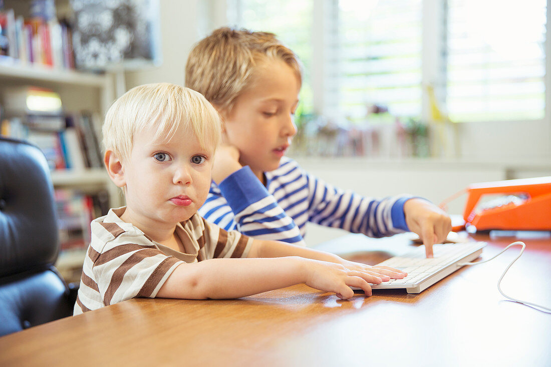 Children using computer together