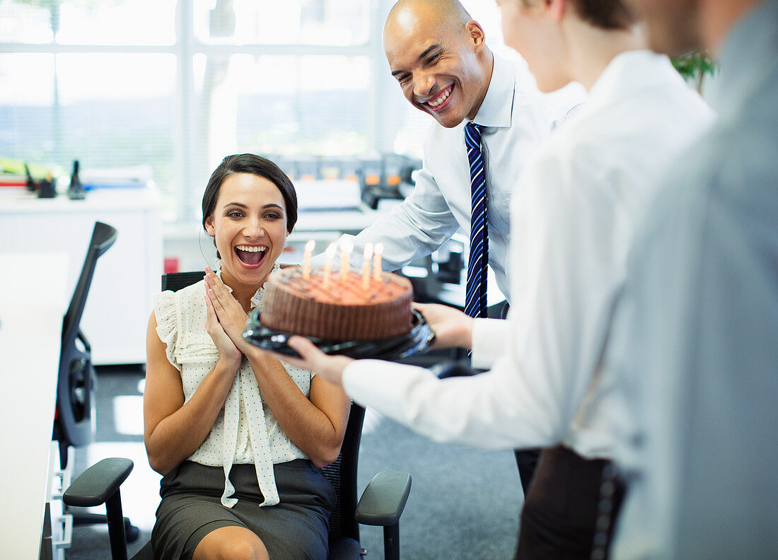 Business people celebrating birthday