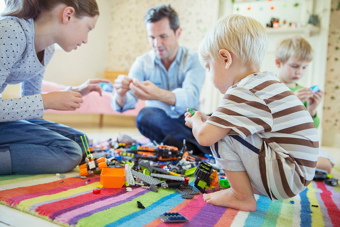 Father playing with children