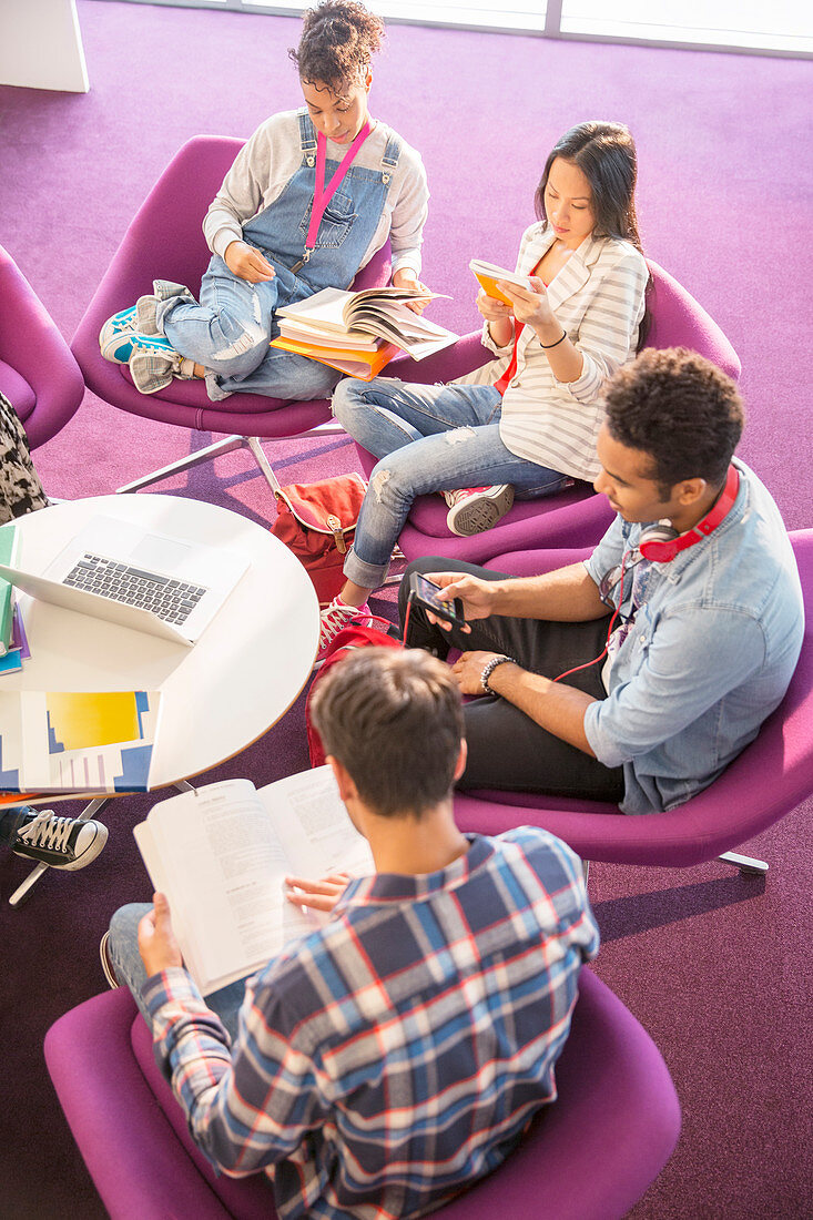 University students reading in lounge