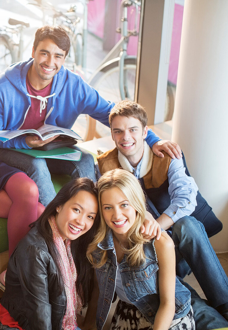 University students smiling in lounge