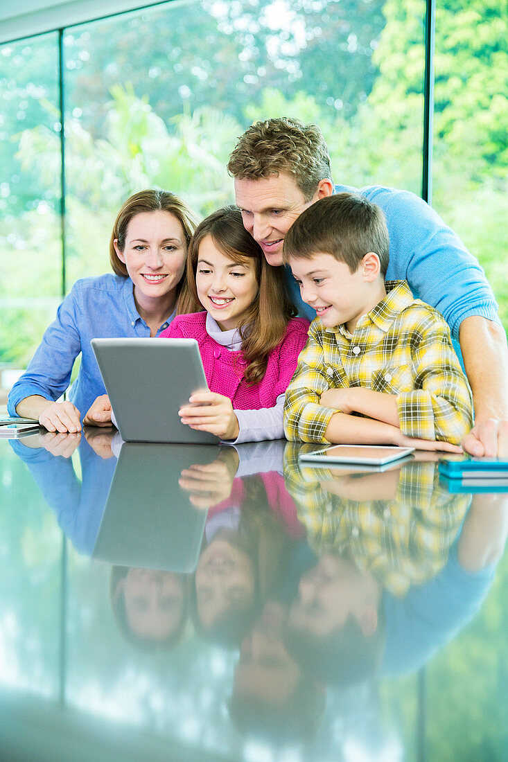 Family using digital tablet together