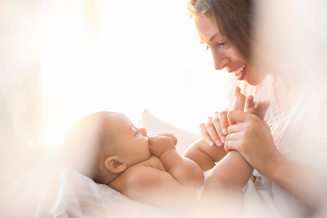 Mother playing with baby boy