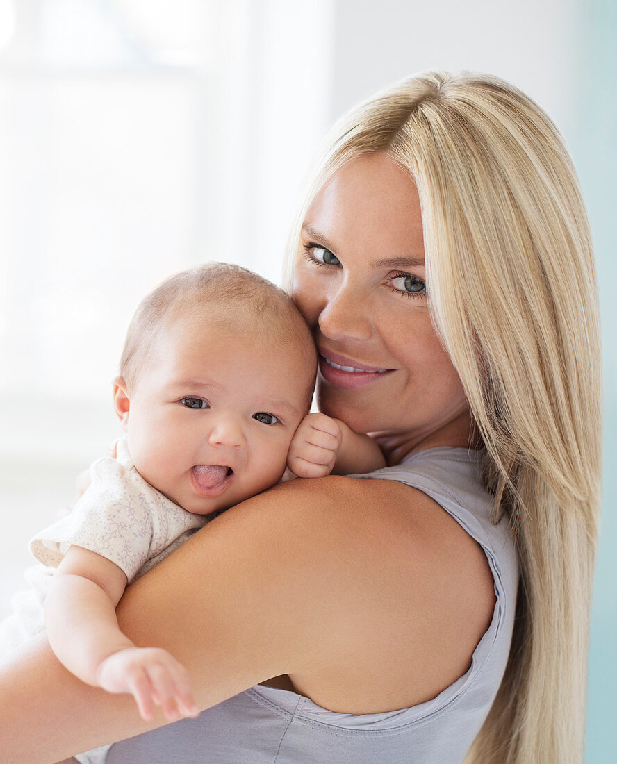 Mother holding baby girl