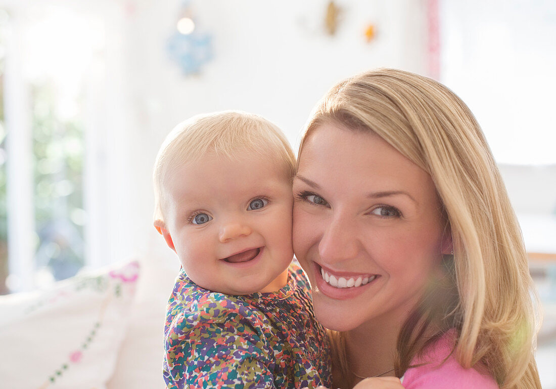 Mother holding baby girl