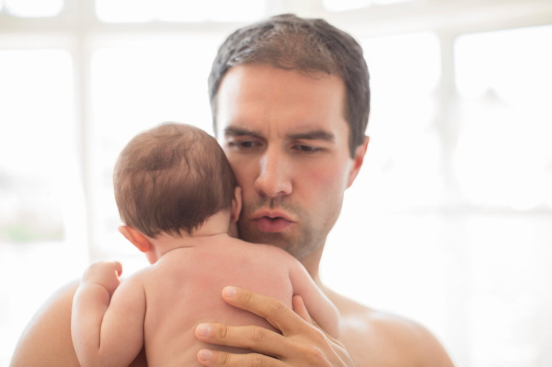 Father holding baby boy