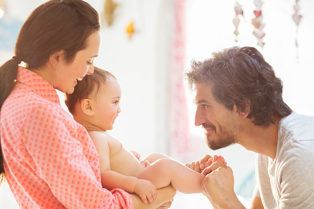 Parents playing with baby boy