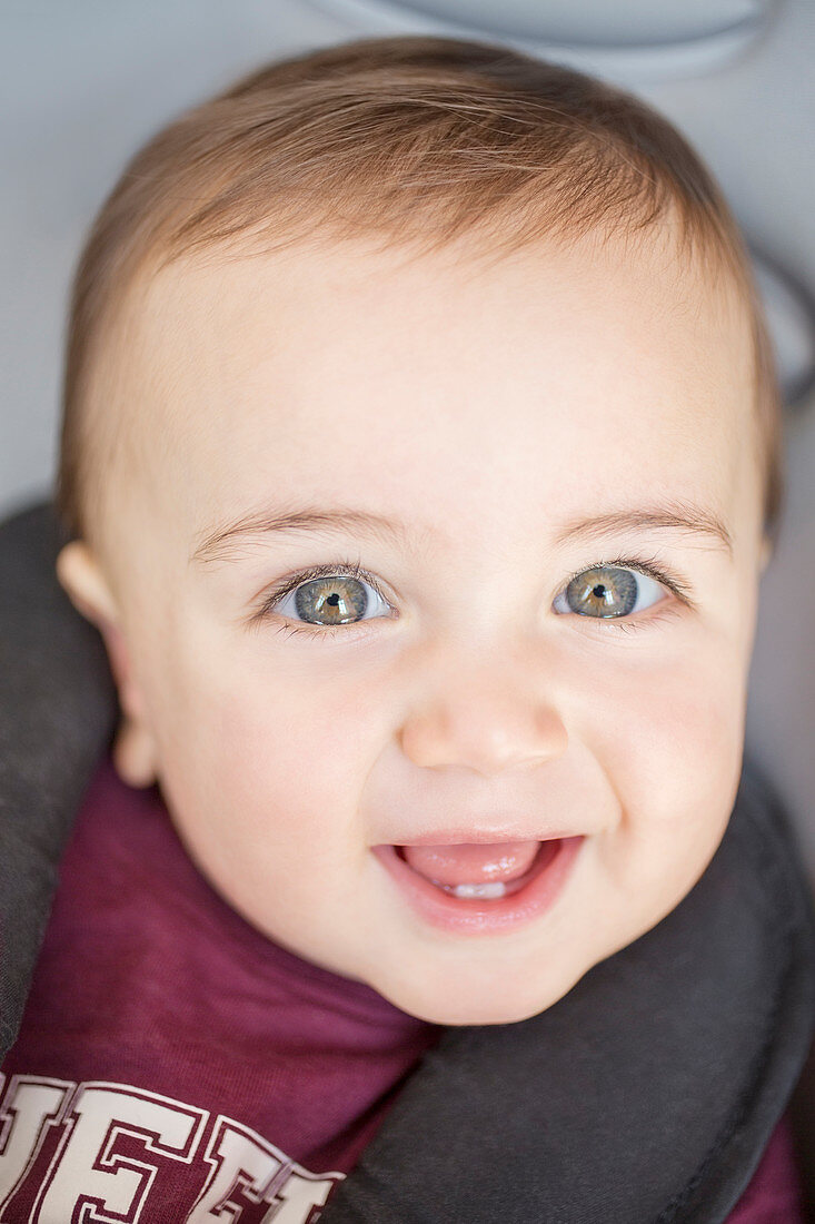 Close up of baby boy's smiling face