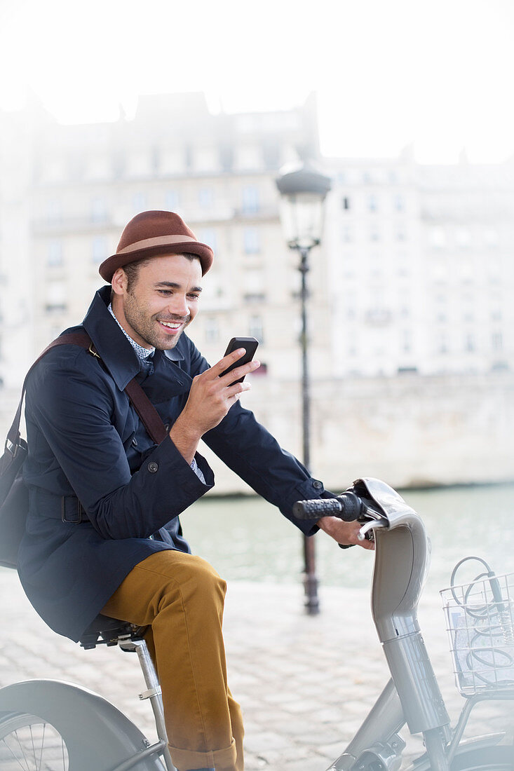 Businessman using cell phone in Paris