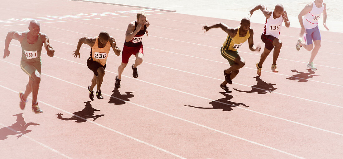 Runners racing on track