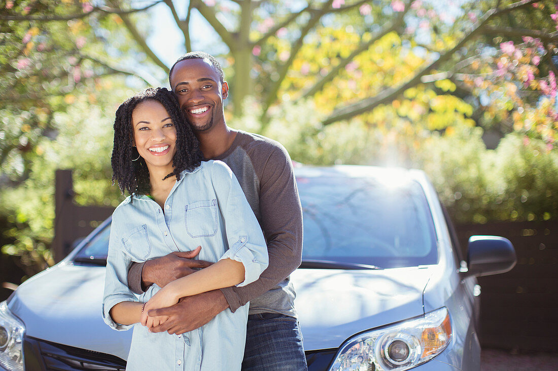 Portrait of happy couple hugging