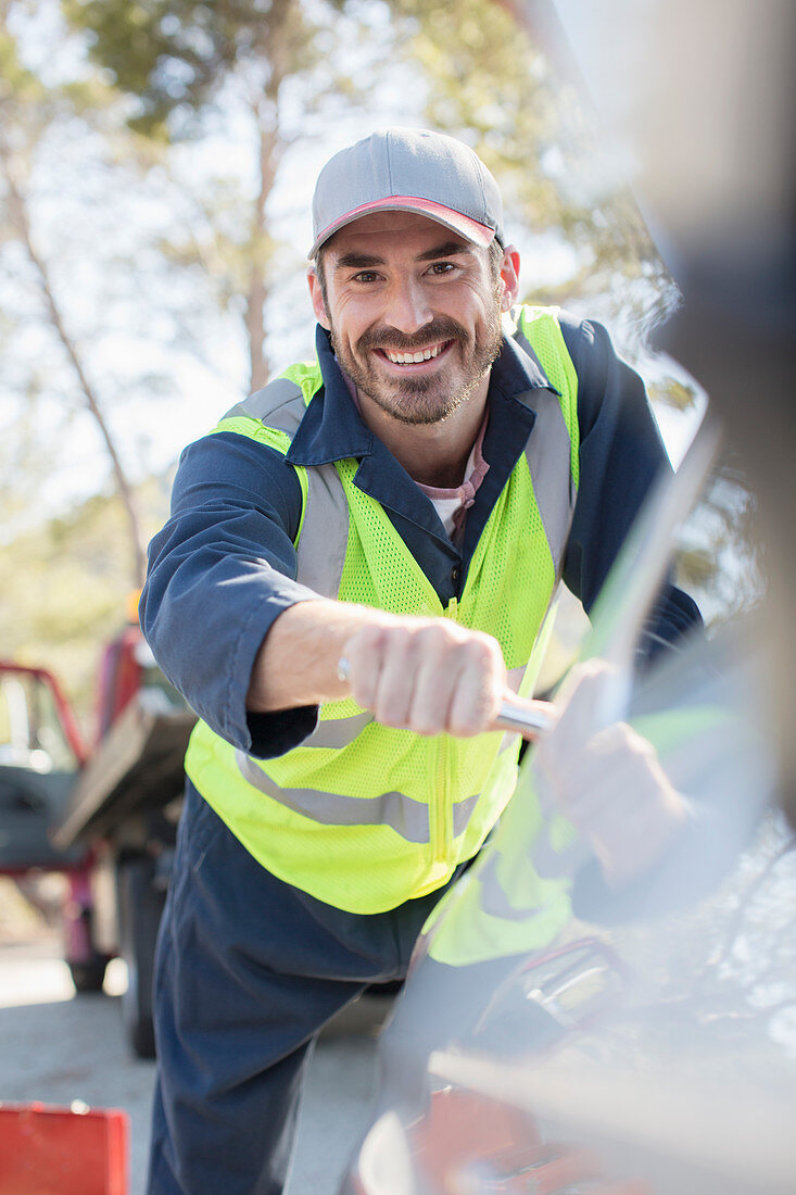 Portrait of smiling roadside mechanic