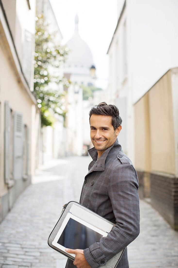 Businessman carrying tablet